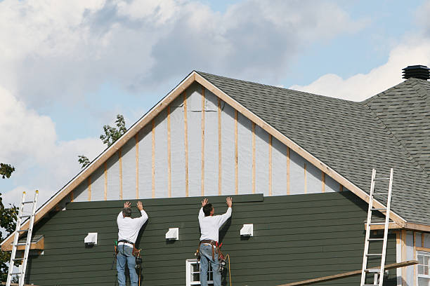 Professional Storm Damage Siding Repair technician working in Collinsville, CT